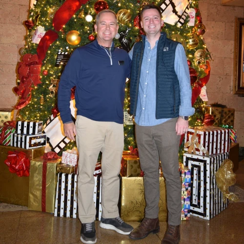 Travis and Ben in front of the Christmas tree